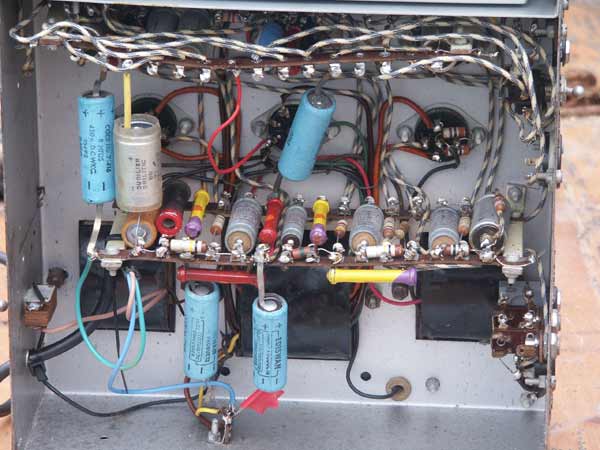 Closer view of the underside of the Concert Master vintage valve tube amplifier, showing components