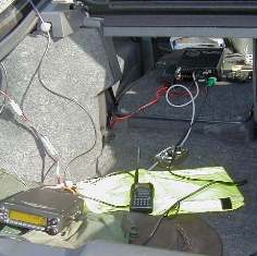 An IC706IIG on 160m and C5900 on 70cm in the back of a Ford Cougar