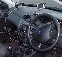 Inside the car, the FT817 feeds the Datong display (in the glove-box), while the two GPS receivers give vehicle heading and APRS positions