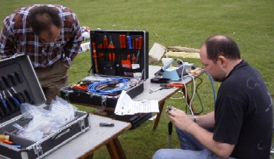 Iain (G4YBN) makes hasty repairs while Phil (M5BTB) supervises