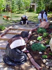 Three Sisters working on the small set of stairs near the new fountain garden