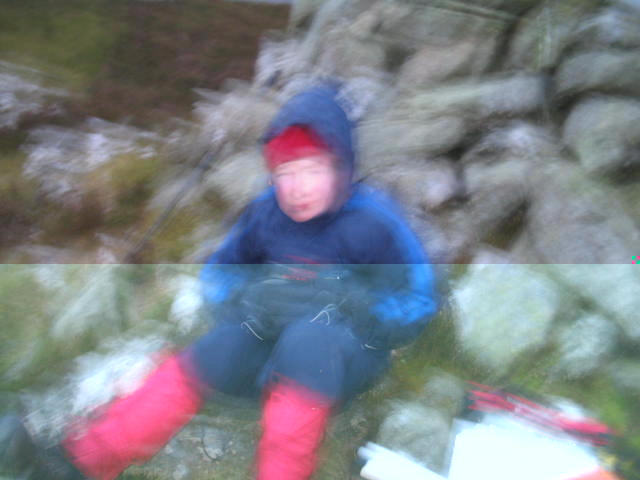 Jimmy by the summit cairn on Mynydd Nodol.  The conditions were unpleasant, so I only took one photo, and it didn't exactly come out.  Never mind...