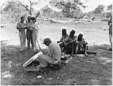 Arch Oboler and his wife Eleanor interviewing the warden of the Tsavo River National Park in kenya. Bill Snyder is operating the first tape recorder to be used in Kenya, a modified Brush Sound Mirror