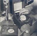 CHECKING EXACT TIME with Hamilton chronometers for precision in radio communications.