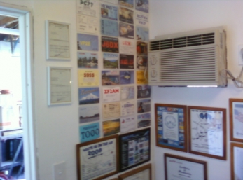 My wall of QSL's and Awards.
