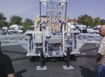 Picture of the US Tower trailor with a 89' tower on it at the Dx Convention.