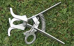 A scissor mole trap