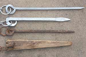 Different types of stakes for use with steel gin traps