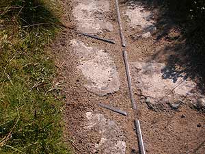 Old tram rails in the concrete, Upton Towans