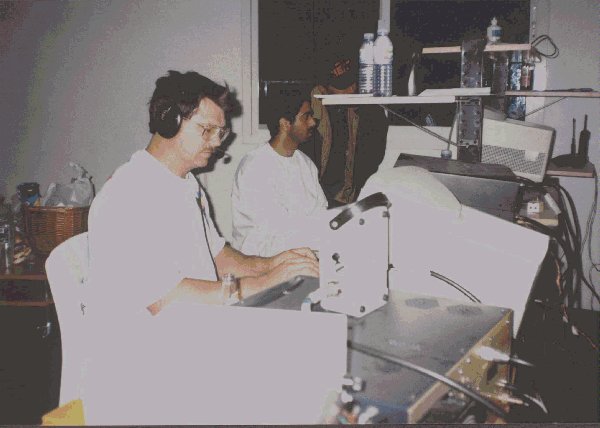 Bernie W3UR in front of A61AJ shack.