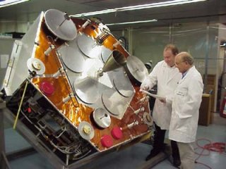 Technicians proudly inspecting the AO-40 satellite prior to launch.