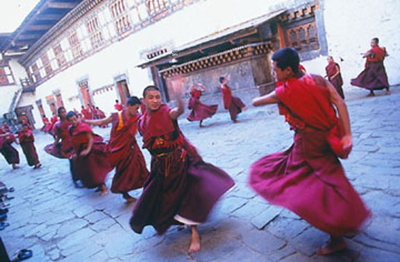 Monks rehearsing before a festival