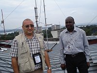  Arik, EK6DO (left) doing inspection of common UN VHF repeater installation in Kinshasa.