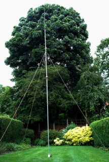 My prototype antenna erected in a small garden. It looks huge in the picture, but it's only 20ft tall!