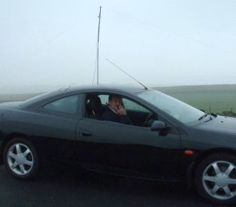 Norman operating on 40m. The mast supporting the dipole feed point can be seen in the background.