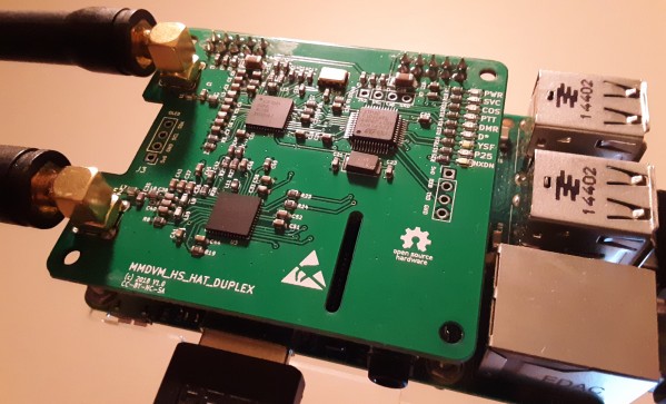 An MMDVM Dual Hat board with antenna on a Raspberry Pi single board computer