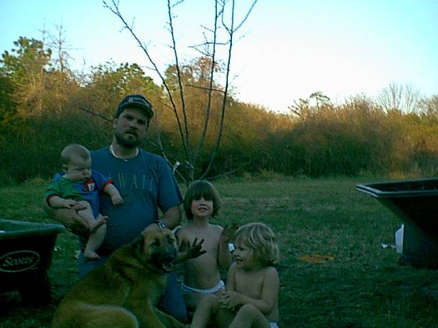 Family photo by the new apple tree.