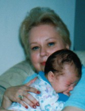 Yvette holding her new granddaughter.