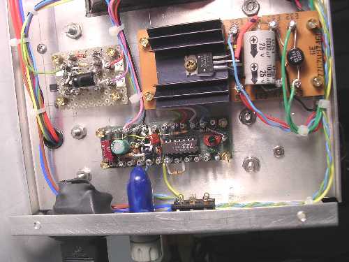 Uncer chassis with shrink tubing over AC terminals.