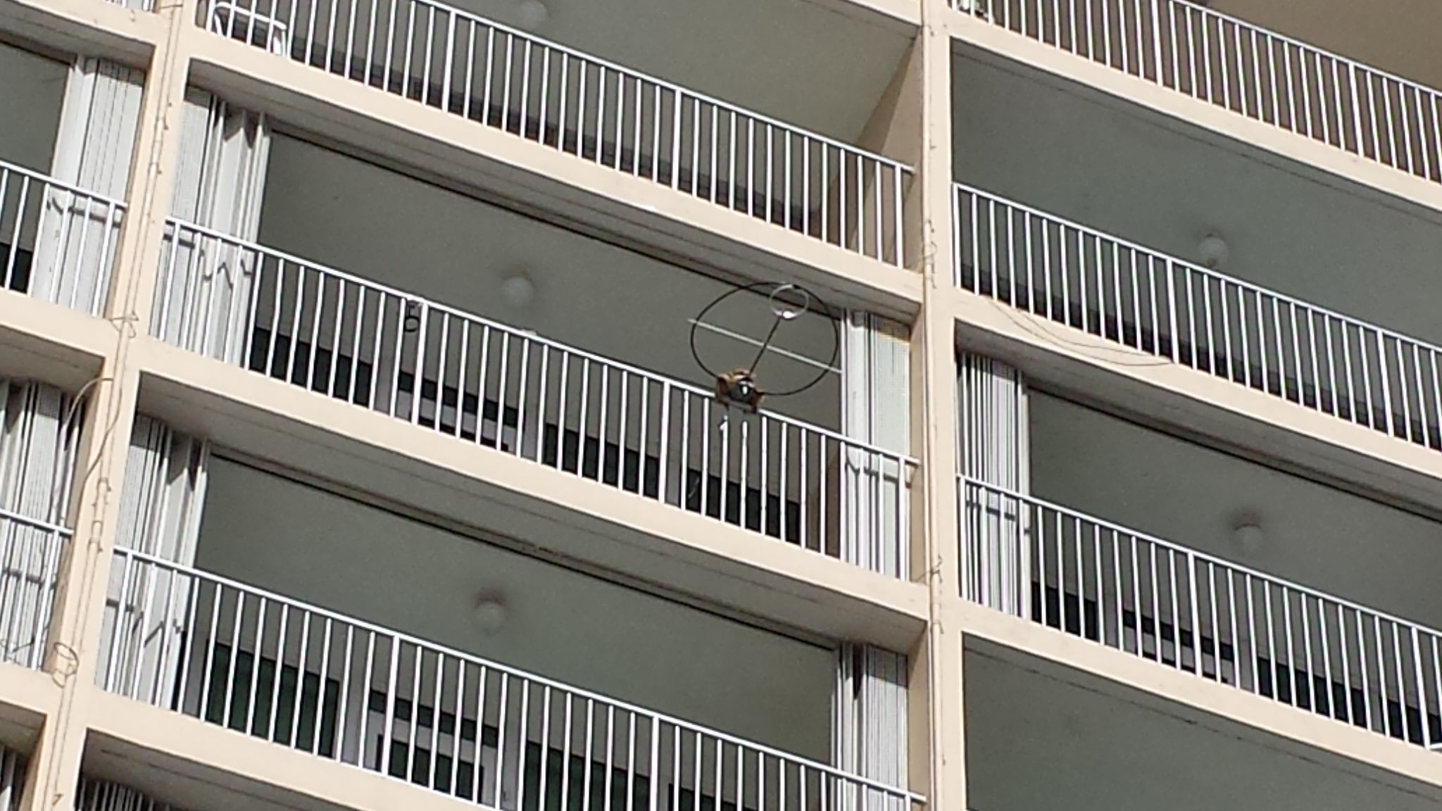 Question: Which
orientation offers optimal performance for a
magnetic loop antenna mounted on a balcony on this
building? Question: Which orientation offers optimal
performance for a magnetic loop antenna mounted on a
balcony on this building?