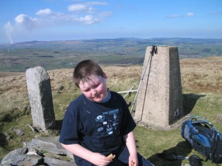 Liam relaxes with a snack at the summit