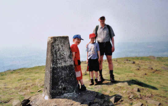 Liam, Lewis and Richard G3CWI, at the summit of Titterstone Clee Hill