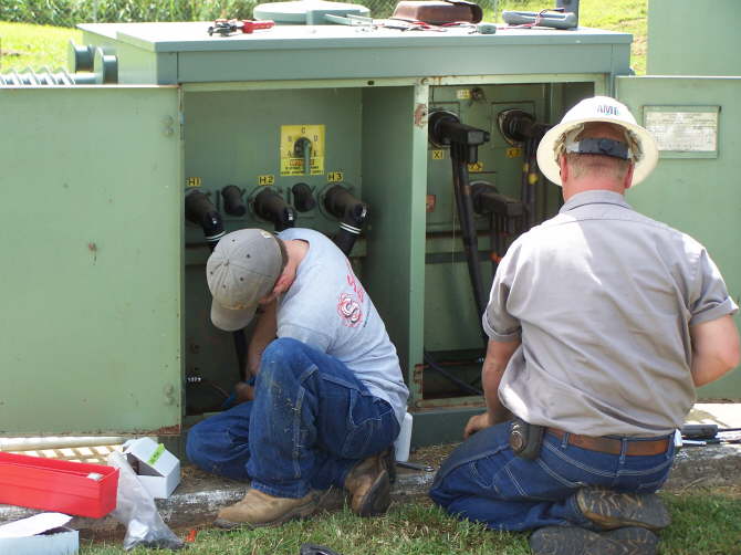 Jason & Wes adding ground circuits to a transformer.