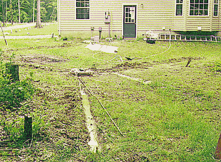 Sinking the ground rods in the radial trenches