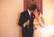 Roy and Paula stealing a kiss in between Toasts
