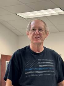 A person in a black shirt

AI-generated content may be incorrect.