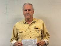 A person holding a piece of paper

AI-generated content may be incorrect.