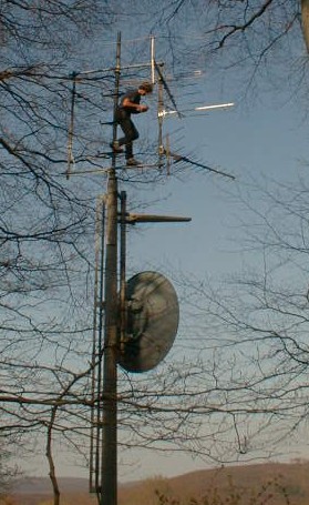 Gerhard, OE3DFC, on the mast mounting two 23cm antennas