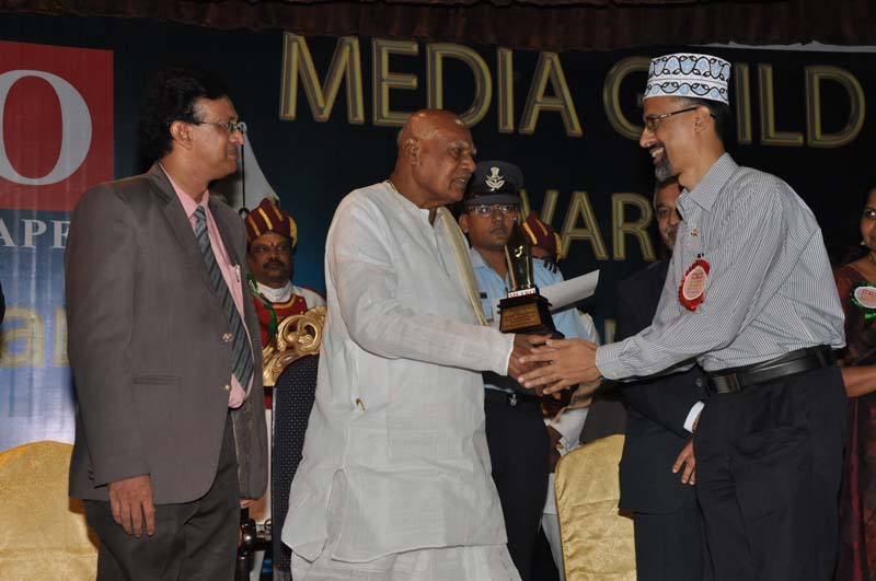 Receiving Media Guild Award From Dr. K. Rosaiah, H.E. The Governor of Tamil Nadu.