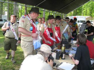Scouts checking out the radio setup.  Sitting at table from left, John, K4KBB, David, W4DWA, and Dave, KV4CN.