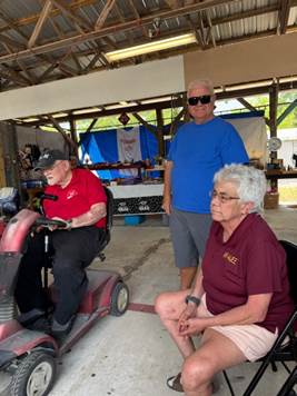A group of people sitting in chairs

Description automatically generated