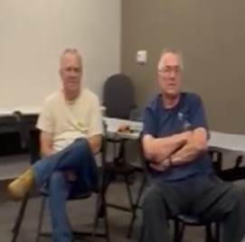 A group of men sitting in chairs

AI-generated content may be incorrect.