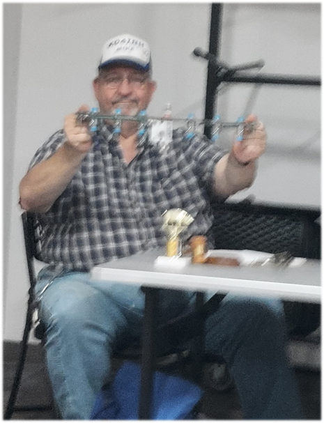 A person sitting at a table

Description automatically generated