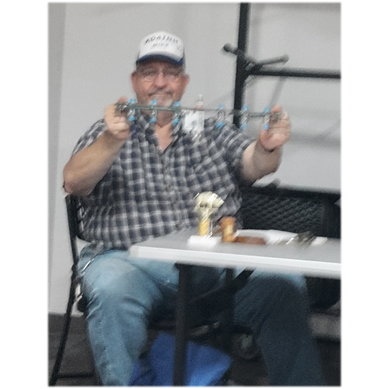 A person sitting at a table

Description automatically generated