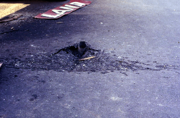 An 122 mm Rocket in the street beside Chow Hall Number Four.