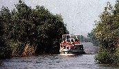 A small passanger ship on the canal
